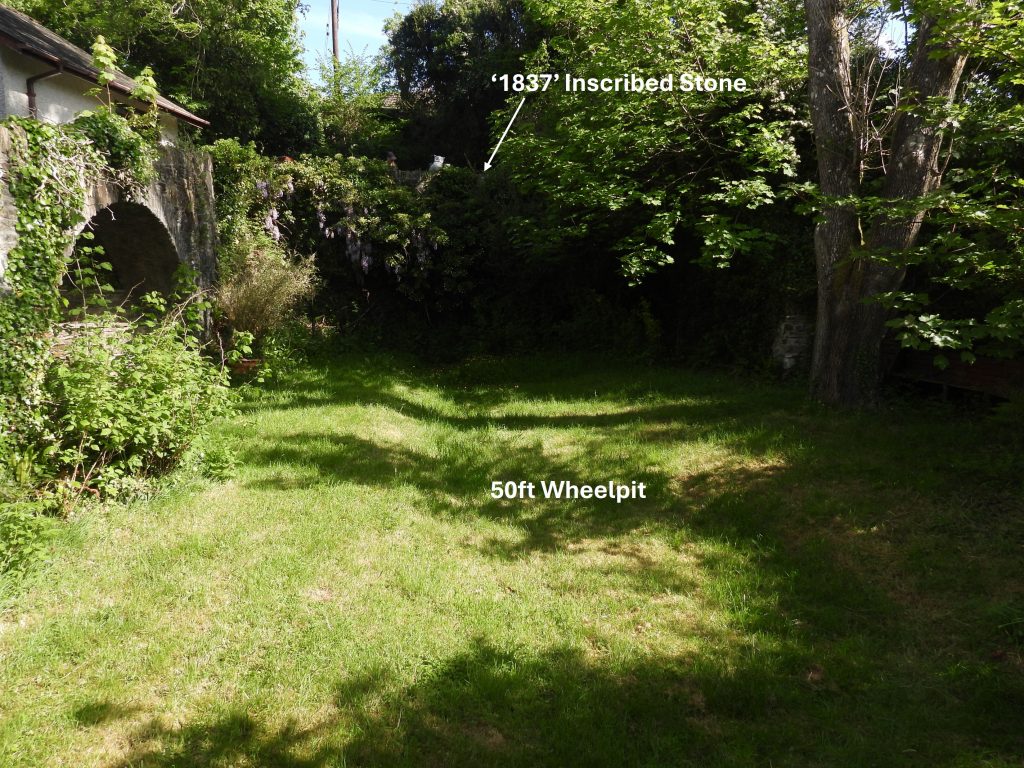 99a. Wheelpit and Inscribed Stone